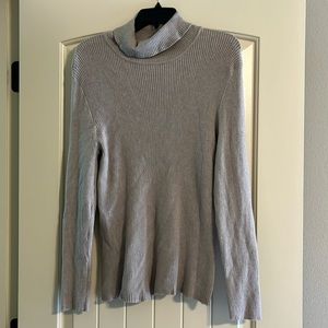 Tan soft turtle neck sweater.